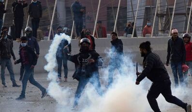 Nepal police fire tear gas as MPs debate US grant